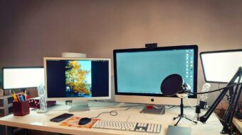 silver imac on brown wooden desk