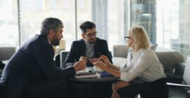 a group of people sitting around a table
