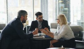 a group of people sitting around a table